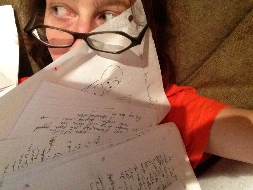 Liz smothered by her own hand written pages